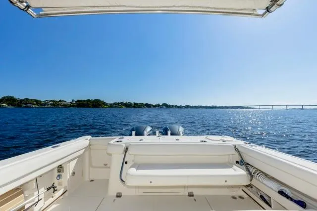  Yacht Photos Pics 2017 Grady-White Freedom 307 boat on open water under clear blue sky.