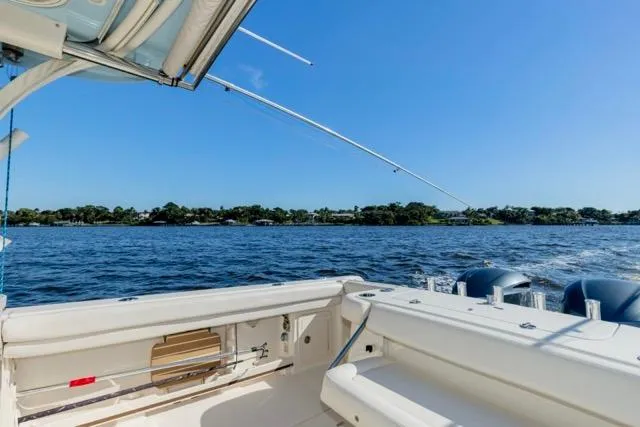  Yacht Photos Pics 2017 Grady-White Freedom 307 boat on open water under clear blue sky.