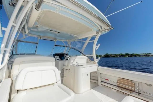  Yacht Photos Pics 2017 Grady-White Freedom 307 boat interior with seating, helm, and ocean view.