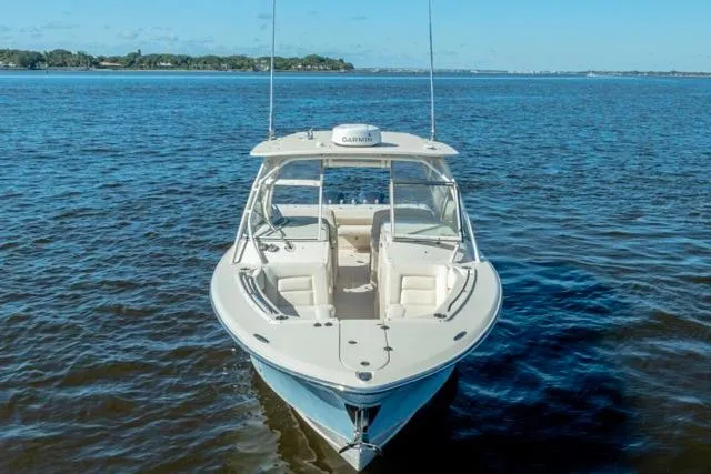  Yacht Photos Pics 2017 Grady-White Freedom 307 boat on open water, clear sky background.