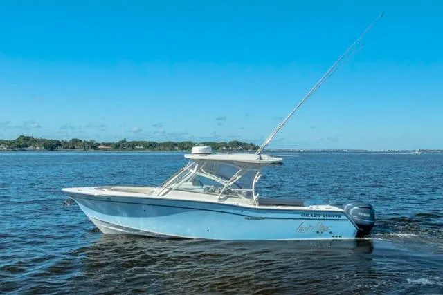  Yacht Photos Pics 2017 Grady-White Freedom 307 boat cruising on open water under clear blue skies.