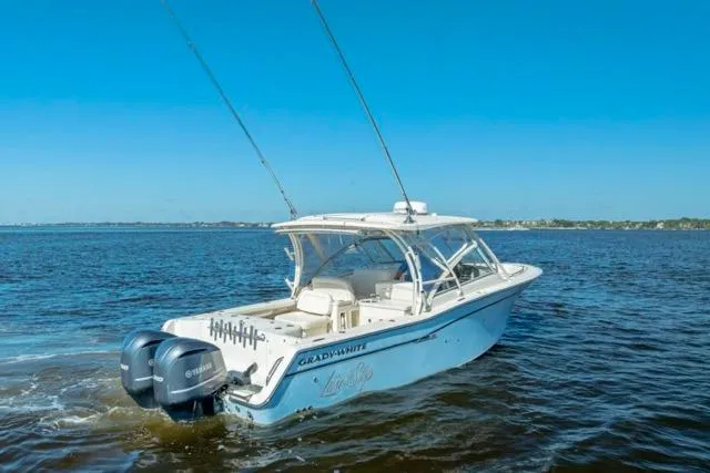  Yacht Photos Pics 2017 Grady-White Freedom 307 boat cruising on open water under clear blue skies.