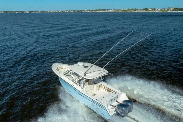  Yacht Photos Pics 2017 Grady-White Freedom 307 boat cruising on open water.