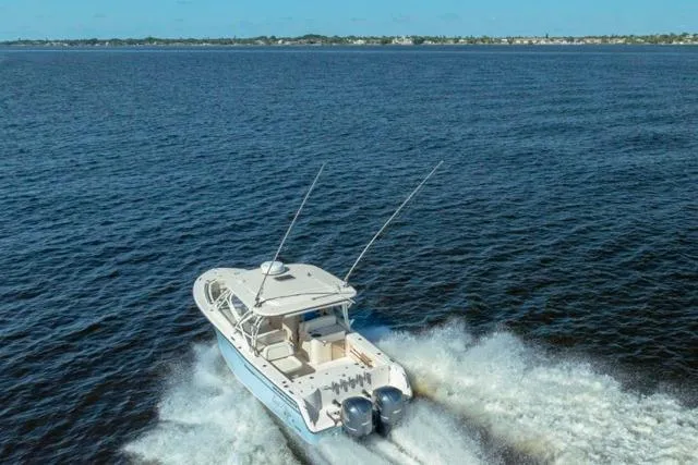  Yacht Photos Pics 2017 Grady-White Freedom 307 boat cruising on open water, showcasing dual engines.