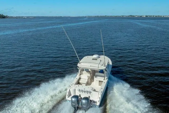  Yacht Photos Pics 2017 Grady-White Freedom 307 boat cruising on open water.