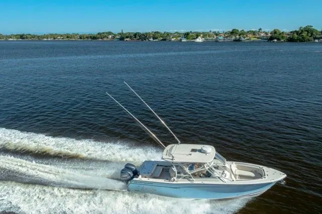  Yacht Photos Pics 2017 Grady-White Freedom 307 boat cruising on a scenic lake.