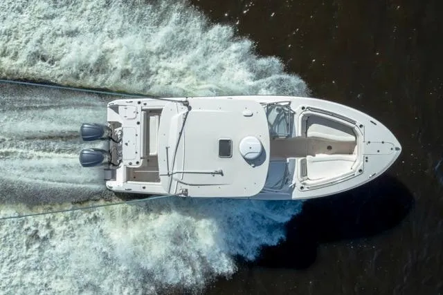  Yacht Photos Pics Overhead view of 2017 Grady-White Freedom 307 boat cruising on water.