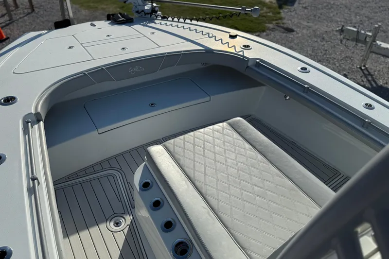  Yacht Photos Pics 2021 Costa Custom Boats 264 HC interior with cushioned seating and sleek design.