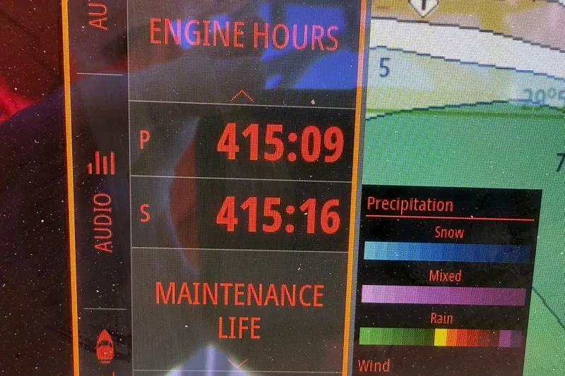  Yacht Photos Pics Display screen showing engine hours and weather data on a 2021 Costa Custom Boats 264 HC.