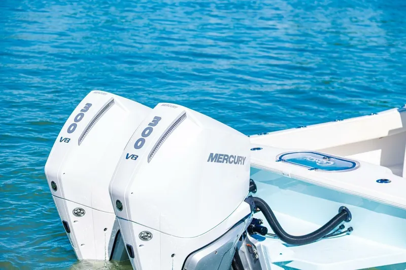  Yacht Photos Pics Twin Mercury 300 V8 engines on a 2022 Conch 27 boat in blue water.