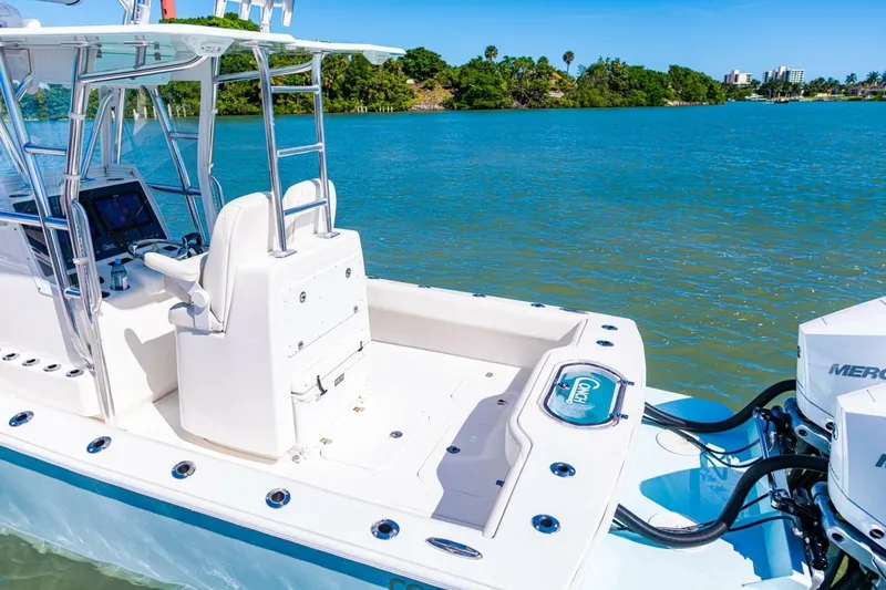  Yacht Photos Pics 2022 Conch 27 boat with dual Mercury engines on a sunny day.