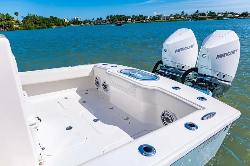  Yacht Photos Pics 2022 Conch 27 boat with dual Mercury engines on a sunny day.