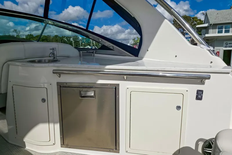  Yacht Photos Pics 2026 Regal 33 XO yacht interior with kitchenette, sink, and storage cabinets.