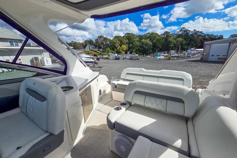  Yacht Photos Pics 2026 Regal 33 XO yacht interior with luxurious seating and outdoor view.