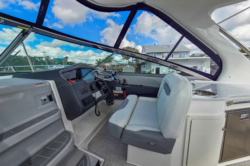  Yacht Photos Pics Interior of 2026 Regal 33 XO boat with modern helm and seating.