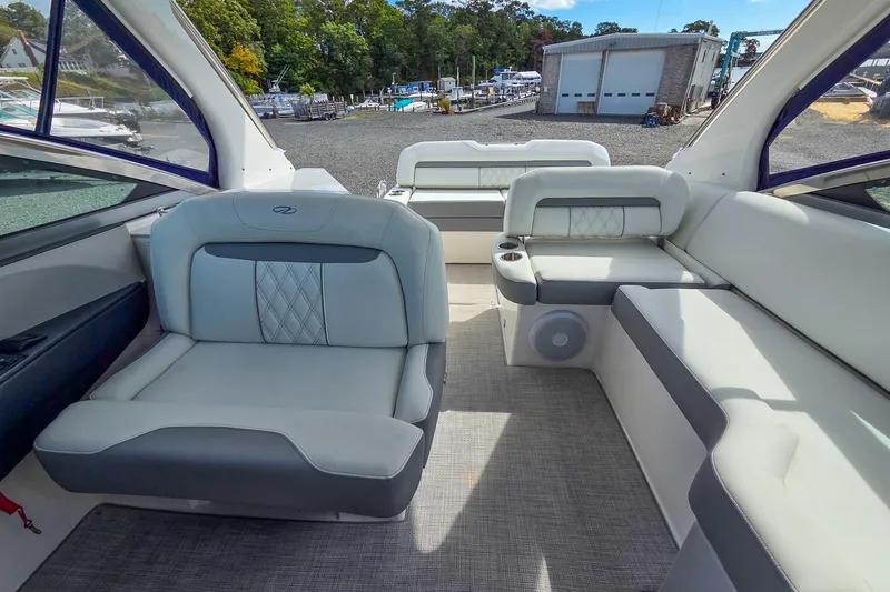  Yacht Photos Pics 2026 Regal 33 XO boat interior with luxurious seating and modern design.