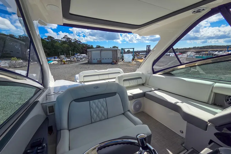  Yacht Photos Pics Interior of 2026 Regal 33 XO yacht with luxurious seating and panoramic windows.