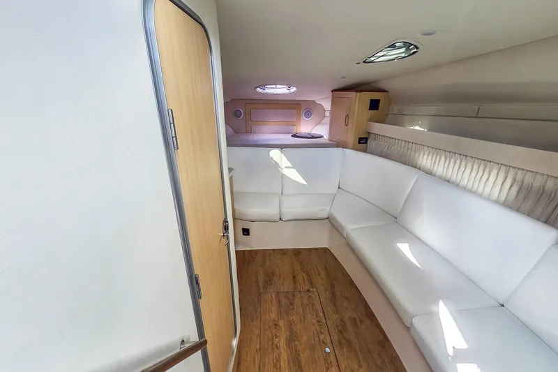  Yacht Photos Pics Interior of 2026 Regal 33 XO yacht with white seating and wood accents.