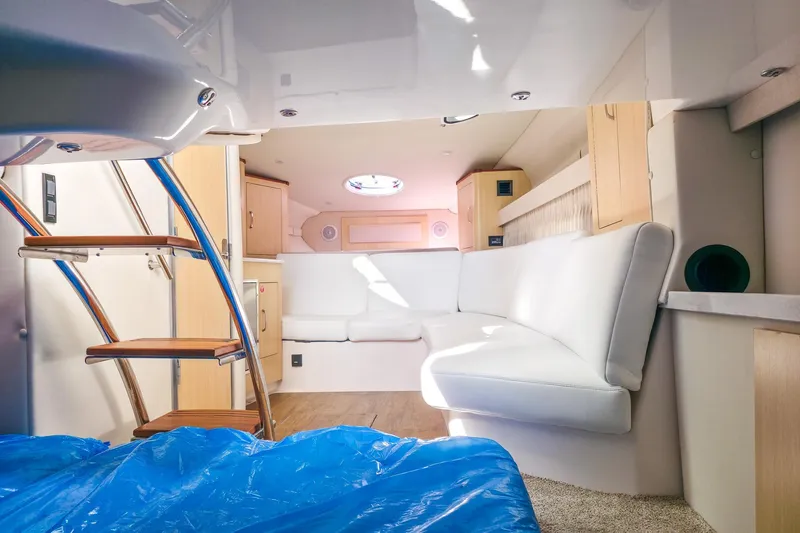  Yacht Photos Pics Interior of 2026 Regal 33 XO yacht with white seating and wooden accents.