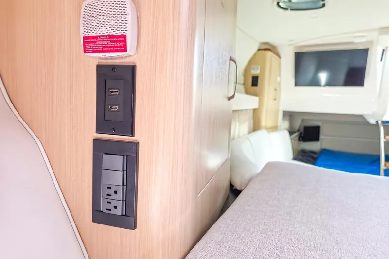  Yacht Photos Pics 2026 Regal 33 XO interior with USB ports, power outlets, and modern amenities.