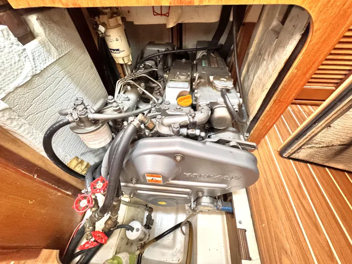 Stormcat Yacht Photos Pics Engine compartment of 2006 Hunter 41 Deck Salon sailboat, featuring Yanmar engine.