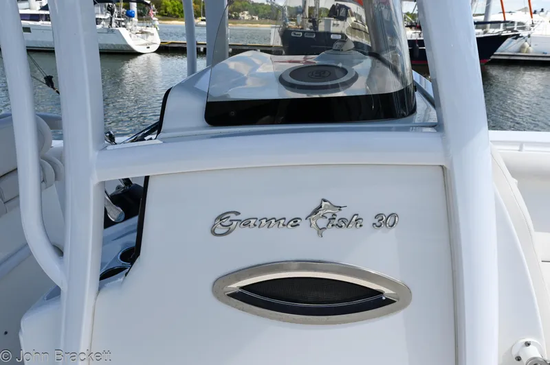 Sea Level Yacht Photos Pics 2014 Sea Hunt Gamefish 30 boat at marina, showcasing sleek design and branding.