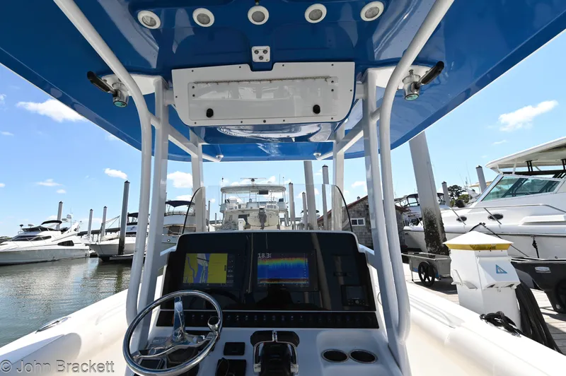 Sea Level Yacht Photos Pics 2014 Sea Hunt Gamefish 30 boat dashboard with navigation equipment at a marina.