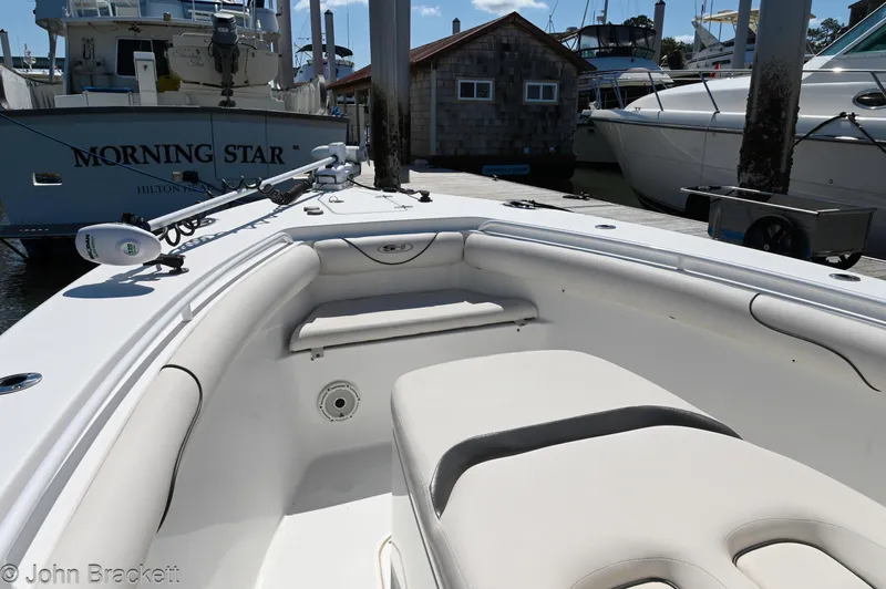 Sea Level Yacht Photos Pics 2014 Sea Hunt Gamefish 30 boat interior at marina, featuring seating and equipment.