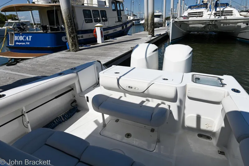 Sea Level Yacht Photos Pics 2014 Sea Hunt Gamefish 30 at marina, featuring spacious deck and twin engines.