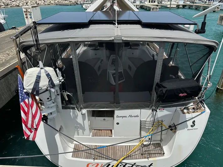  Yacht Photos Pics 2014 Beneteau Oceanis 50 docked, featuring solar panels and an American flag.