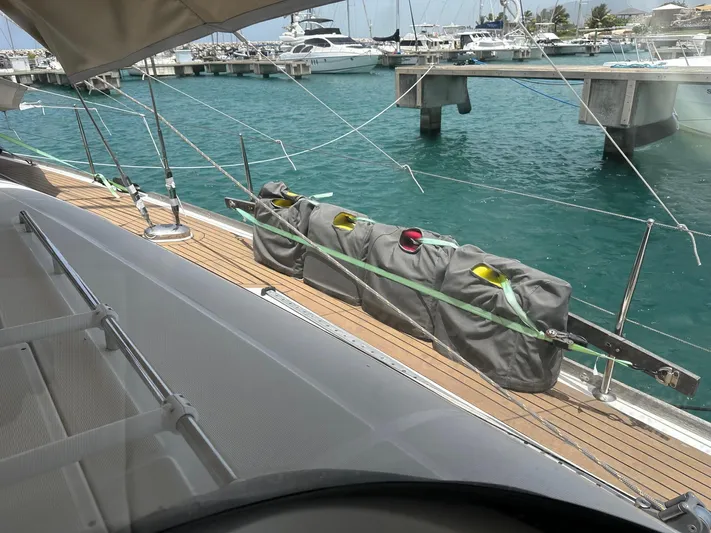  Yacht Photos Pics Beneteau Oceanis 50 sailboat deck, 2014 model, docked at marina with turquoise water.