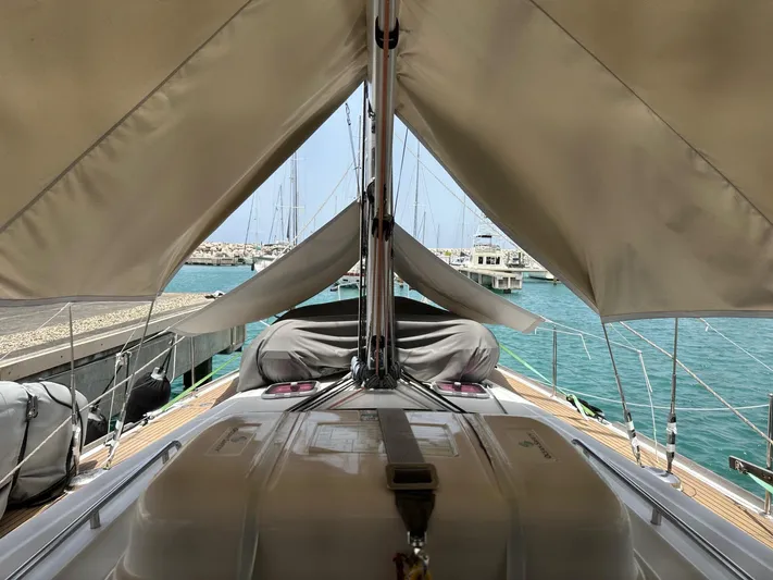  Yacht Photos Pics 2014 Beneteau Oceanis 50 sailboat docked, featuring covered deck and marina view.