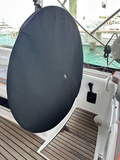  Yacht Photos Pics Beneteau Oceanis 50 yacht helm with cover, 2014 model, docked with wooden deck.