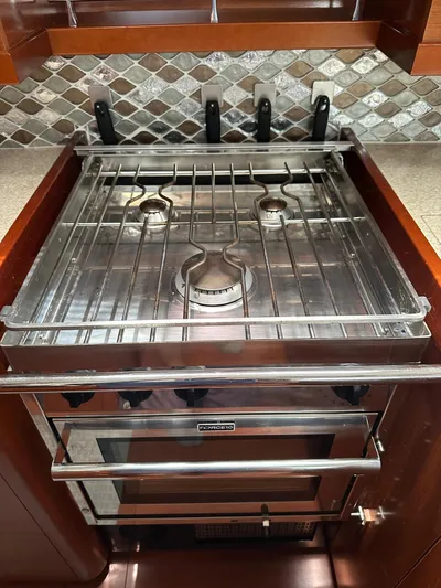  Yacht Photos Pics Stainless steel stove in 2014 Beneteau Oceanis 50 yacht kitchen with tiled backsplash.