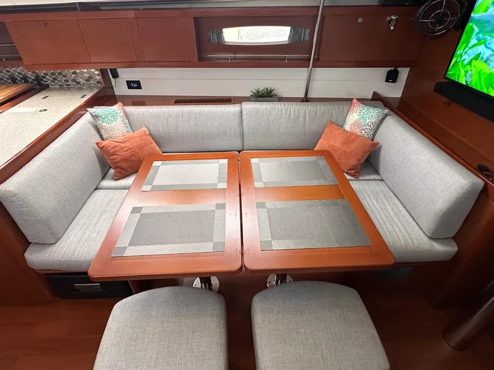  Yacht Photos Pics Luxurious interior of 2014 Beneteau Oceanis 50 yacht with elegant seating and dining area.