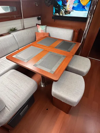  Yacht Photos Pics Interior of 2014 Beneteau Oceanis 50 yacht with elegant dining area and modern decor.