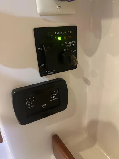  Yacht Photos Pics Control panel on a 2014 Beneteau Oceanis 50 yacht, showing pump and tank indicators.