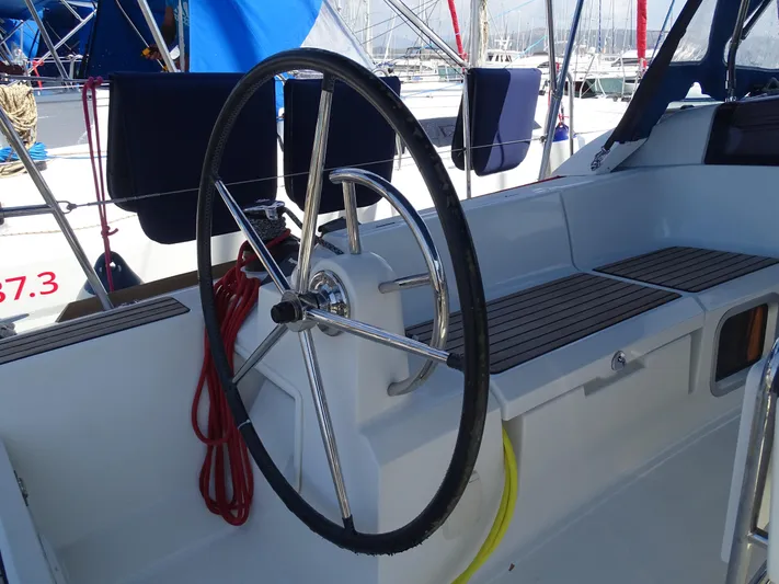 Sea Sea Rider Yacht Photos Pics Steering wheel of 2017 Jeanneau Sun Odyssey 389 sailboat, docked in marina.