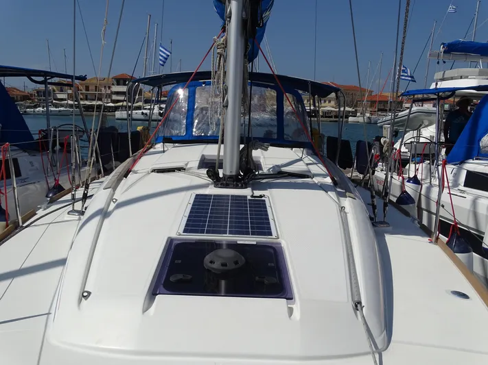 Sea Sea Rider Yacht Photos Pics 2017 Jeanneau Sun Odyssey 389 sailboat docked in marina, featuring solar panel on deck.