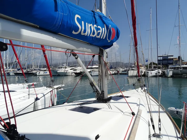 Sea Sea Rider Yacht Photos Pics 2017 Jeanneau Sun Odyssey 389 sailboat docked in a marina, featuring a blue Sunsail cover.