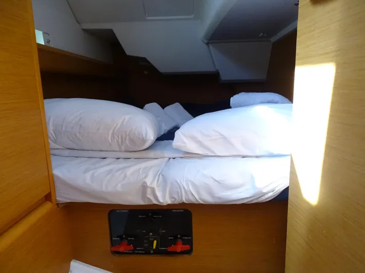 Sea Sea Rider Yacht Photos Pics Cozy cabin interior of 2017 Jeanneau Sun Odyssey 389 sailboat with neatly arranged bedding.