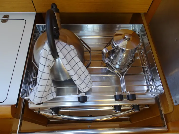 Sea Sea Rider Yacht Photos Pics Stainless steel kettle and pot on Jeanneau Sun Odyssey 389 yacht kitchen shelf.