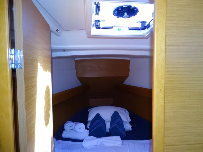 Sea Sea Rider Yacht Photos Pics Cozy cabin interior of 2017 Jeanneau Sun Odyssey 389 sailboat with bedding and skylight.