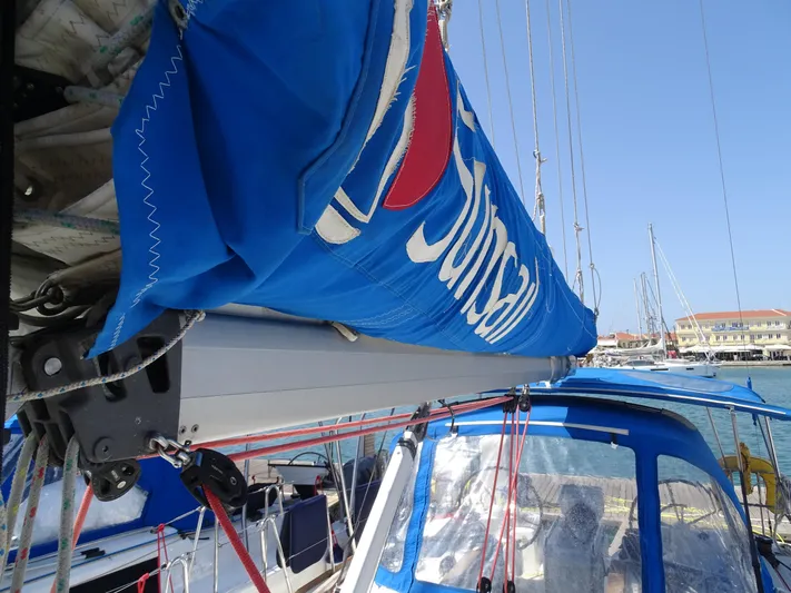 Sea Sea Rider Yacht Photos Pics 2017 Jeanneau Sun Odyssey 389 sailboat with blue sail cover in marina.