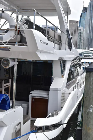  Yacht Photos Pics 2018 Azimut Flybridge yacht docked in a marina, showcasing sleek design and modern features.