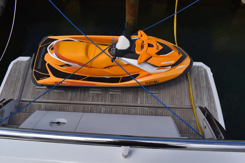  Yacht Photos Pics Orange Sea-Doo jet ski secured on 2018 Azimut Flybridge yacht deck.
