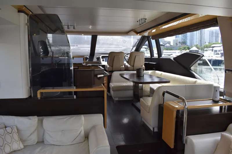  Yacht Photos Pics Luxurious interior of a 2018 Azimut Flybridge yacht with modern seating and panoramic windows.