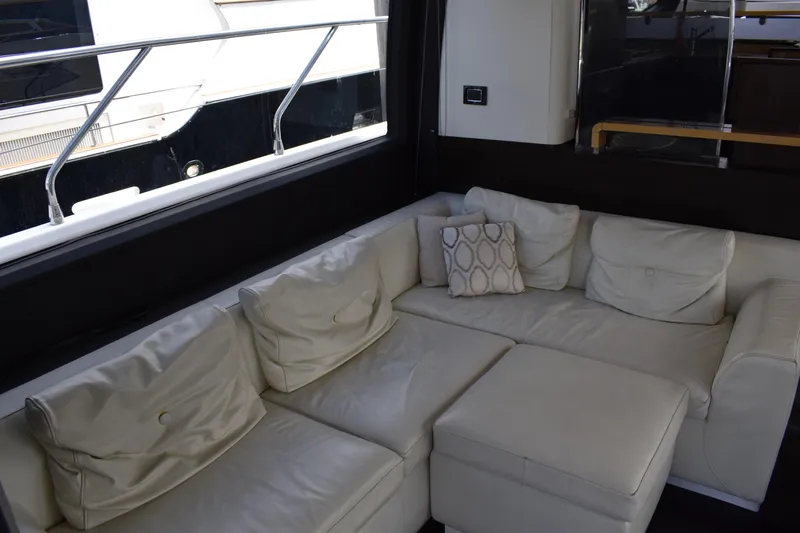  Yacht Photos Pics Luxurious interior of 2018 Azimut Flybridge yacht with white leather seating.