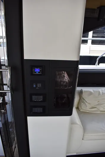  Yacht Photos Pics 2018 Azimut Flybridge yacht interior with control panel and seating area.