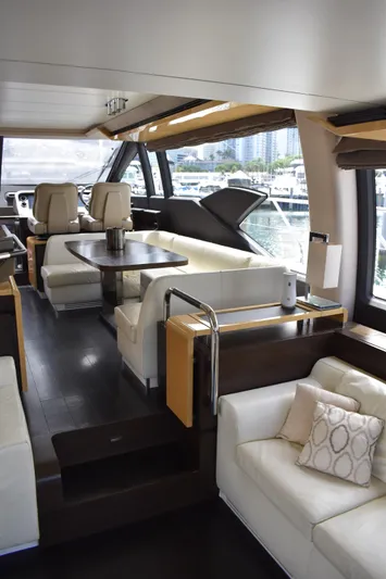  Yacht Photos Pics Luxurious interior of a 2018 Azimut Flybridge yacht with elegant seating and dining area.